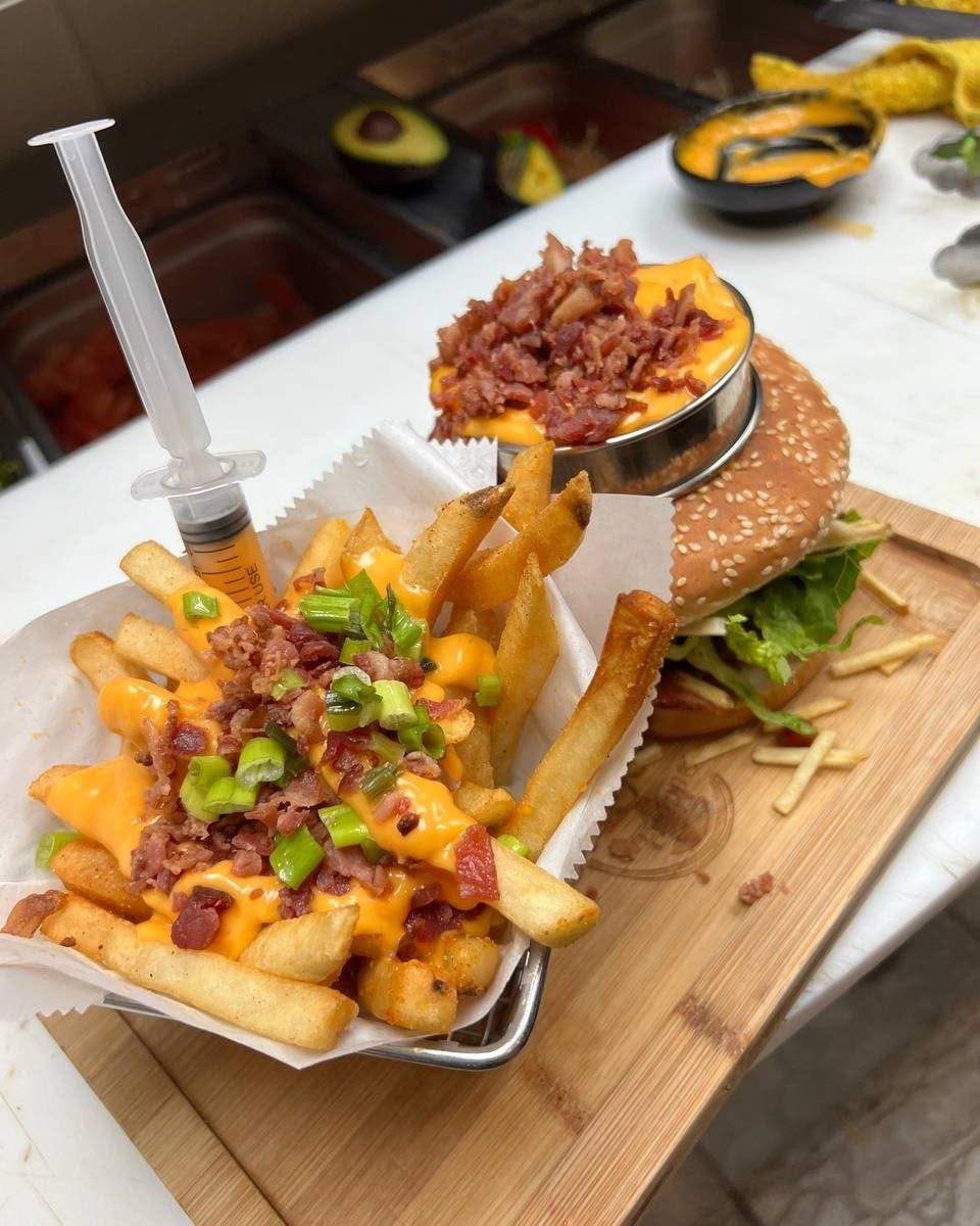 Chiqui burger with loaded cheese and bacon fries
