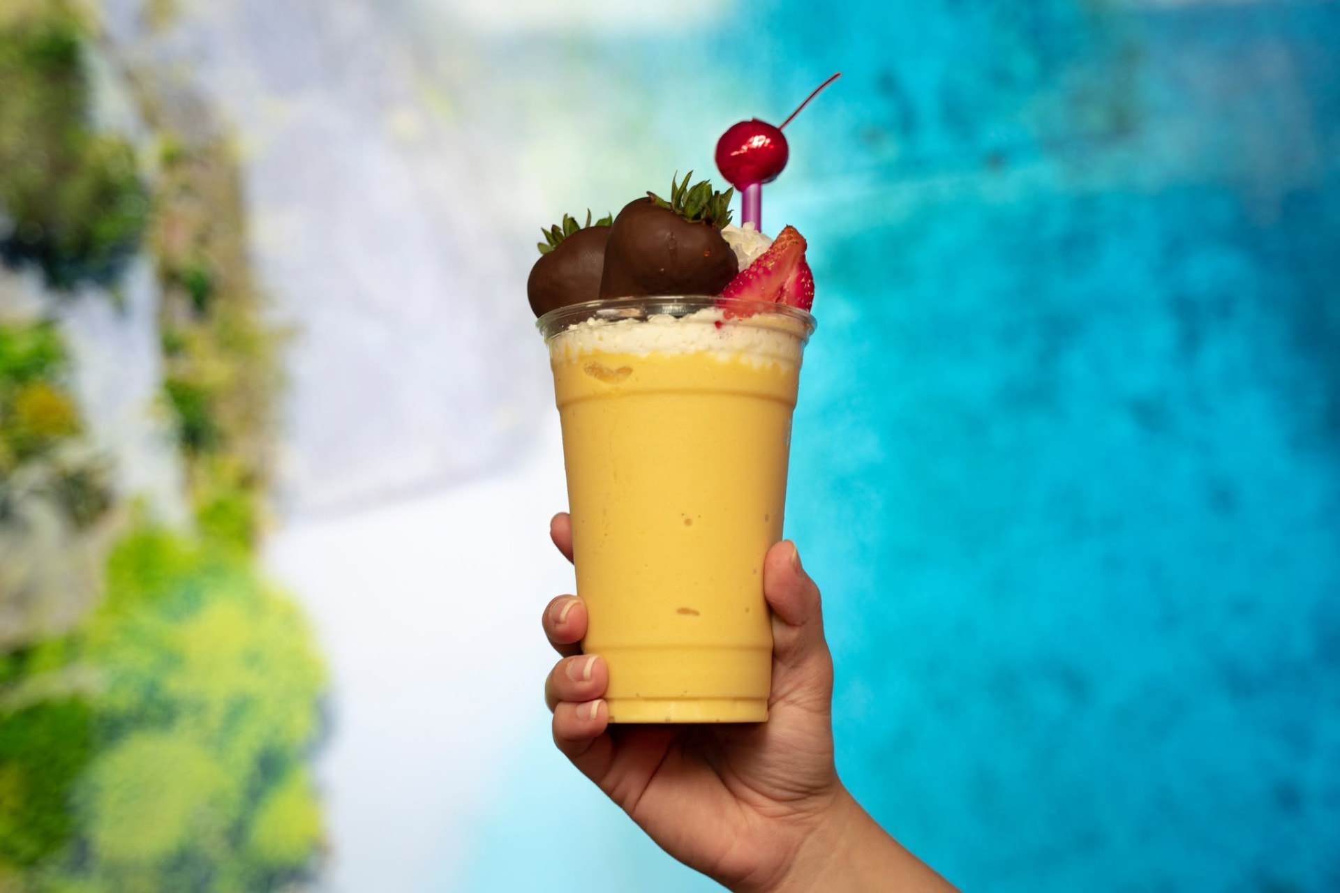 Tropical mango colada topped with chocolate strawberries